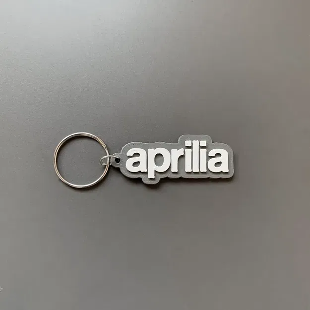 Móc khóa thương hiệu Aprilia in 3D với thiết kế đơn giản - Image 1