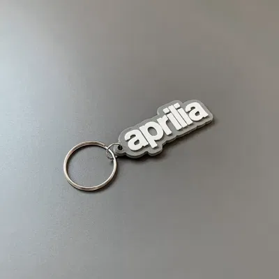 Móc khóa thương hiệu Aprilia in 3D với thiết kế đơn giản