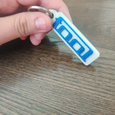 Móc khóa hình logo ban nhạc Tool