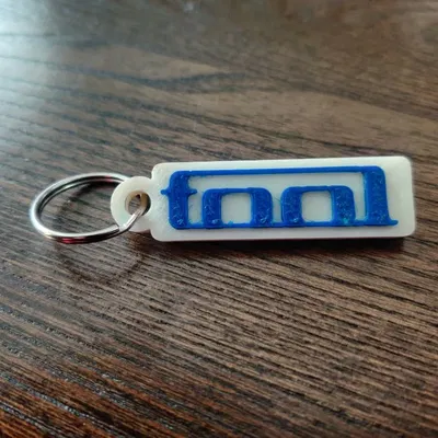 Móc khóa hình logo ban nhạc Tool