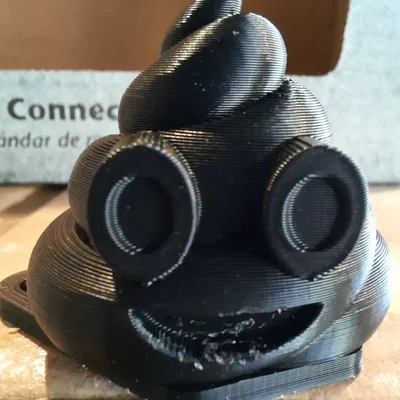 Chìa khóa đựng biểu tượng phân emoji nhỏ