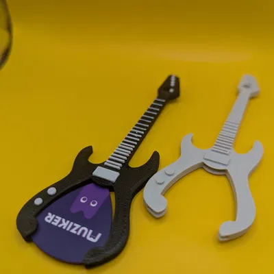 Móc khóa guitar hình dáng đàn guitar cho người yêu nhạc