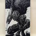 Giáp Berserker Guts với kiếm trong manga Berserk - Thumbnail 3