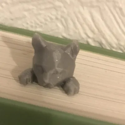 Dấu sách mèo dễ thương nhìn qua trang sách yêu thích của bạn