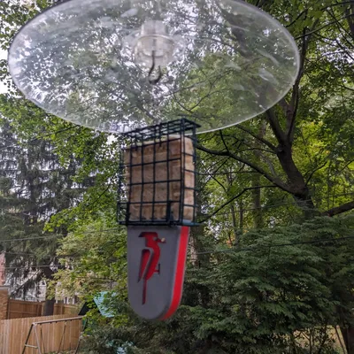 Giá đỡ đuôi cho bộ cho chim ăn mỡ kiểu lồng