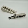 Giá đỡ cửa The Doors Stop độc đáo và tiện lợi - Thumbnail 1
