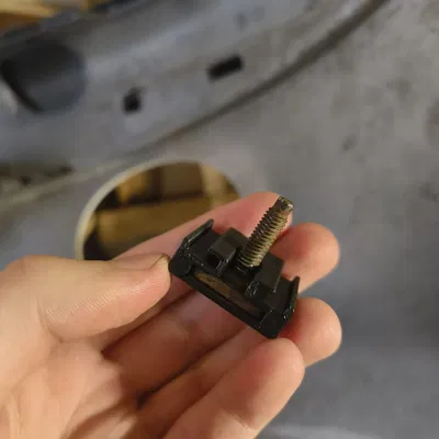 Tấm gắn ốc cản trước xe Peugeot 206