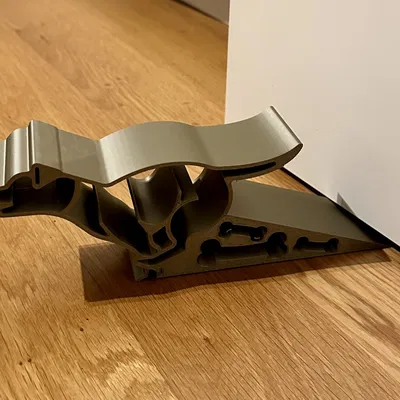 Đế chặn cửa hình chó chạy ngoài trời