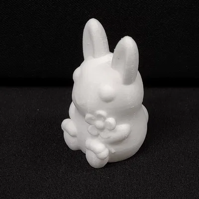 Thỏ cầm hoa trang trí cho mùa xuân và lễ Phục Sinh