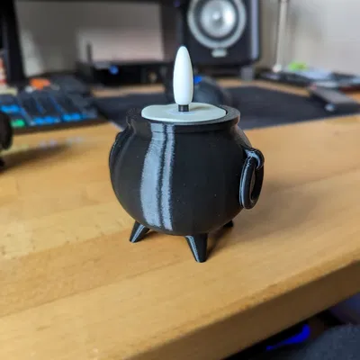 Nồi phép thuật cho đèn trà điện trong dịp Halloween