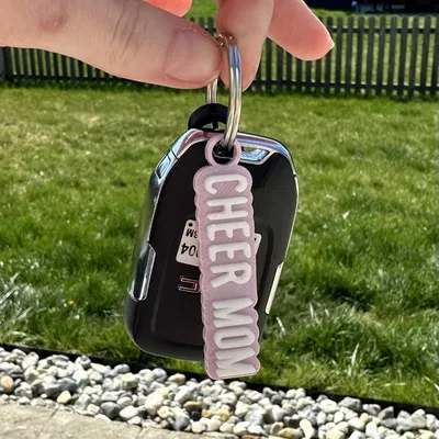 Móc khóa cho mẹ cổ vũ với phiên bản AMS