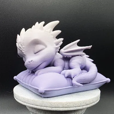 Rồng con ngủ trên gối mềm mại