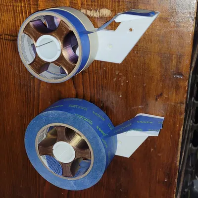 Giá đỡ và dispenser băng dính gắn tường