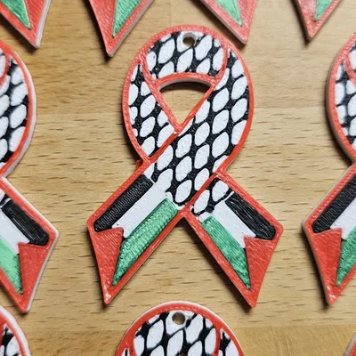 Ruy băng với khăn keffiyeh và cờ Palestine