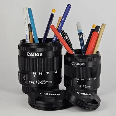 Hộp đựng ống kính Canon EF-S 18-55mm và giá đỡ bút