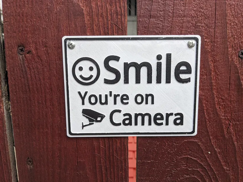 Biển báo "Cười lên, bạn đang ở trên camera" với lỗ vít - Image 1