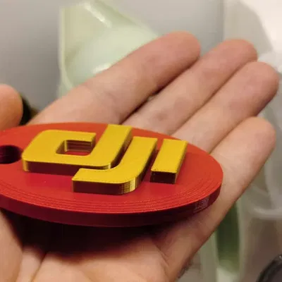 Móc khóa logo DJI cho ba lô và phụ kiện drone