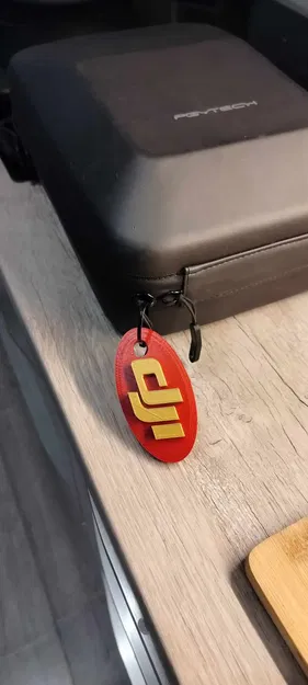 Móc khóa logo DJI cho ba lô và phụ kiện drone - Image 3