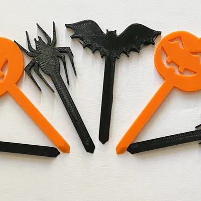 Nắp bánh cupcake Halloween với hình bí ngô, nhện và dơi