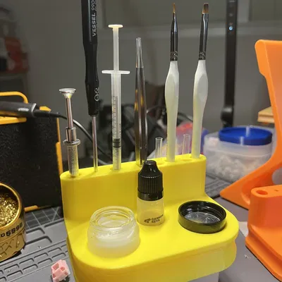 Giá đỡ công cụ và dầu bôi trơn cho bàn phím