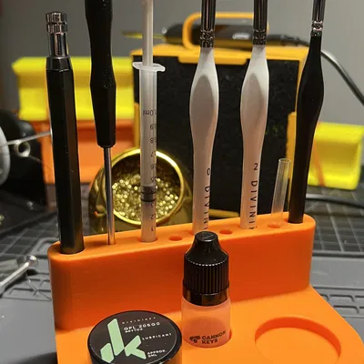 Giá đỡ công cụ và dầu bôi trơn cho bàn phím