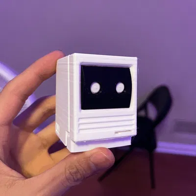 Mô hình Macintosh cổ điển mini với mắt robot