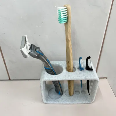 Giá đỡ dao cạo và bàn chải đánh răng cho một người