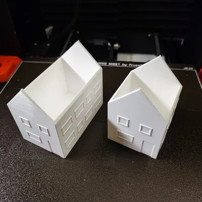 Mô hình nhà thu nhỏ với thiết kế mái và thân riêng biệt