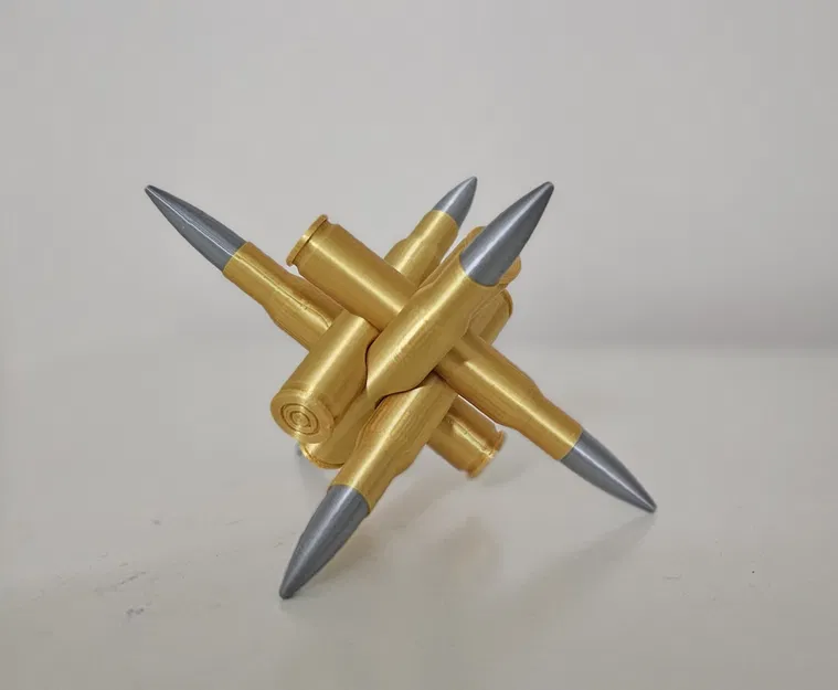 Câu đố hình trụ, viên đạn và bút sáp trên bàn làm việc - Image 2