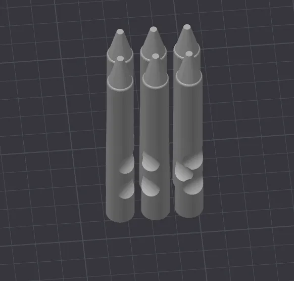 Câu đố hình trụ, viên đạn và bút sáp trên bàn làm việc - Image 6