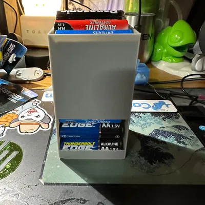 Hộp đựng pin AA với dây cao su và khe cắm hình "X