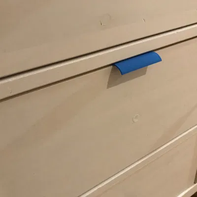 Relocated Drawer Knob or Handle