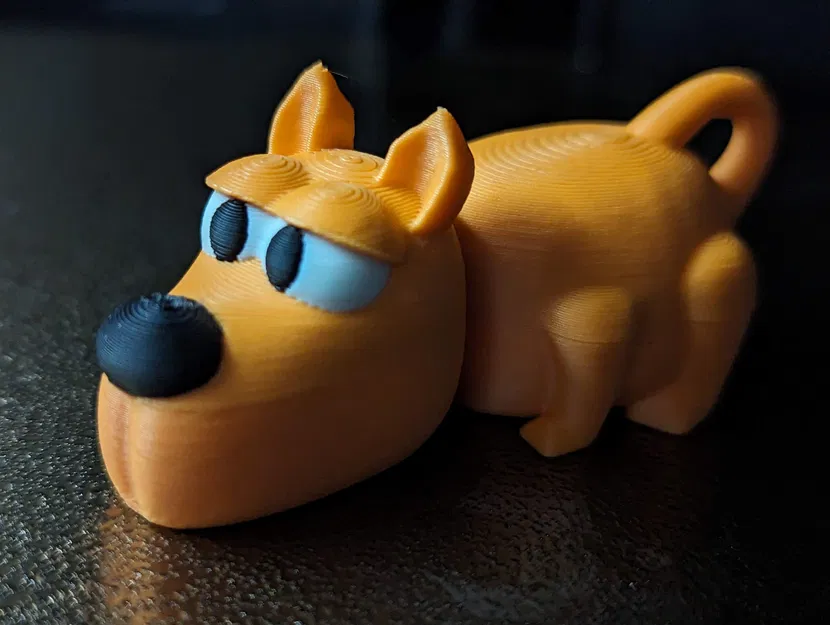 Móc Khóa Chó Flexi In Nguyên Khối - Image 1