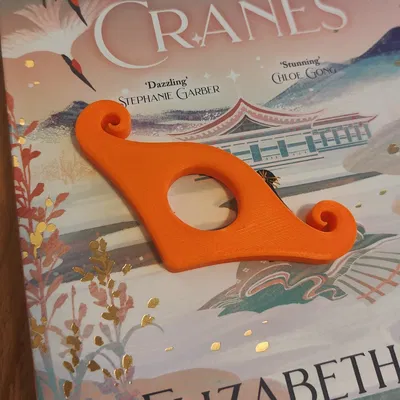 Dụng Cụ Giữ Trang Sách Bìa Mềm