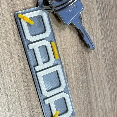 QÁDR Keychain logo