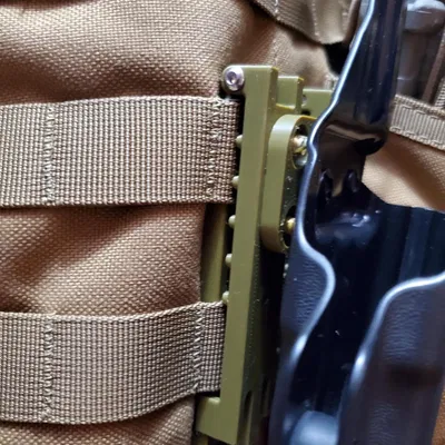 Mussy Molle clips to Vedder holster