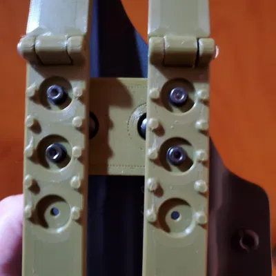 Mussy Molle clips to Vedder holster