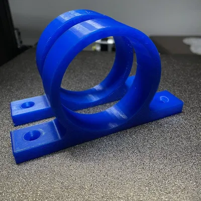 Giá đỡ súng bơm keo gắn kệ