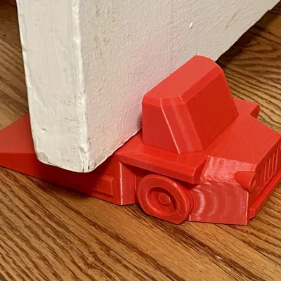 Cục Chặn Cửa Hình Xe Tải