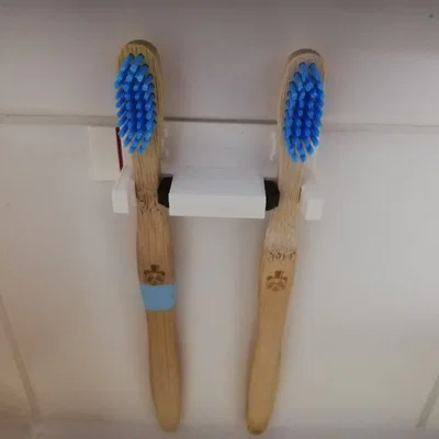 Holder for toothbrushes to be mounted on a wall