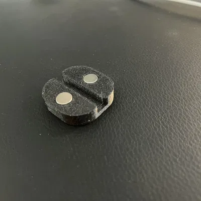 Magnetic cable holder for Secret Lab desks or other magnetic tables