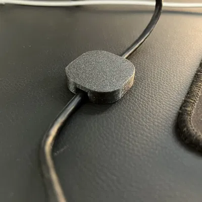 Magnetic cable holder for Secret Lab desks or other magnetic tables