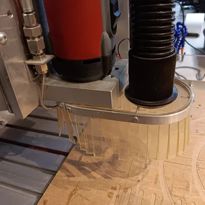 Dustshoe vacuum connector