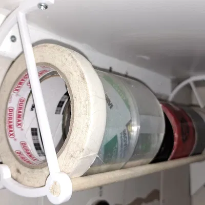 Giá Đỡ Cuộn Băng Keo Dưới Gầm Kệ