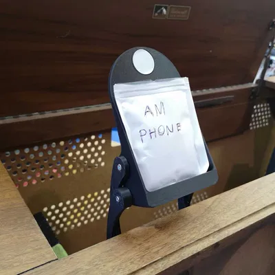 "Stow-away" Cantilevered Phone Stand with NFC tag recess and magnetic position lock