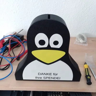 Ống heo hoặc Hộp quyên góp Tux