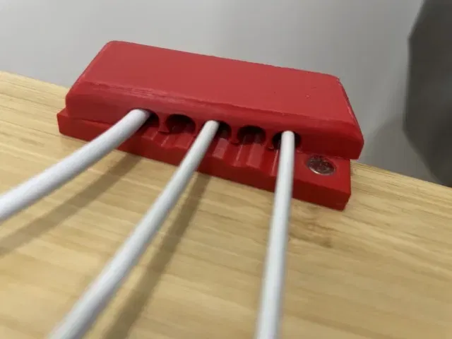 Magnetic cable organizer for desk with clamps - Image 1