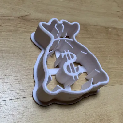 cookie cutter from money bag