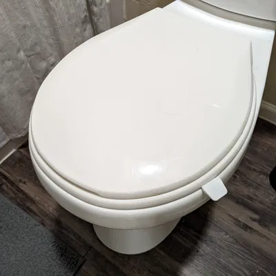 Tay nâng nắp bồn cầu