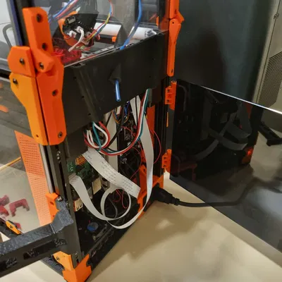 Voron 0: Tấm ốp lưng bản lề kèm giá đỡ cuộn dây filament